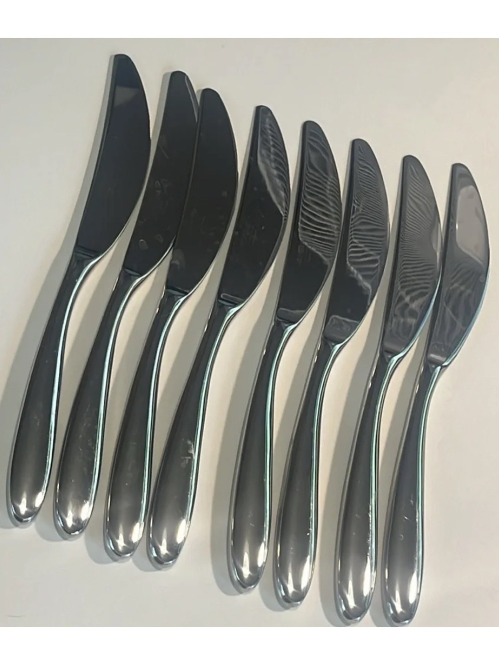 Set of 8 nambe Bend stainless table knives EUC